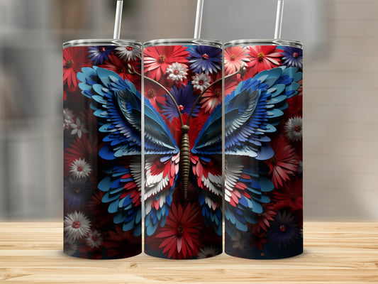 Red, white, and blue butterfly tumbler surrounded by flowers.