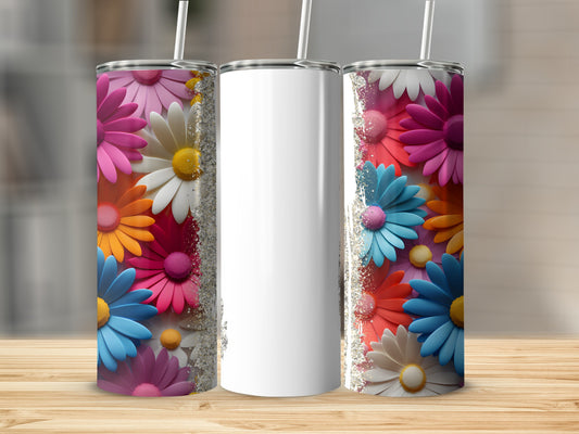 Three tumblers with colorful floral designs and white centers on a wooden surface.
