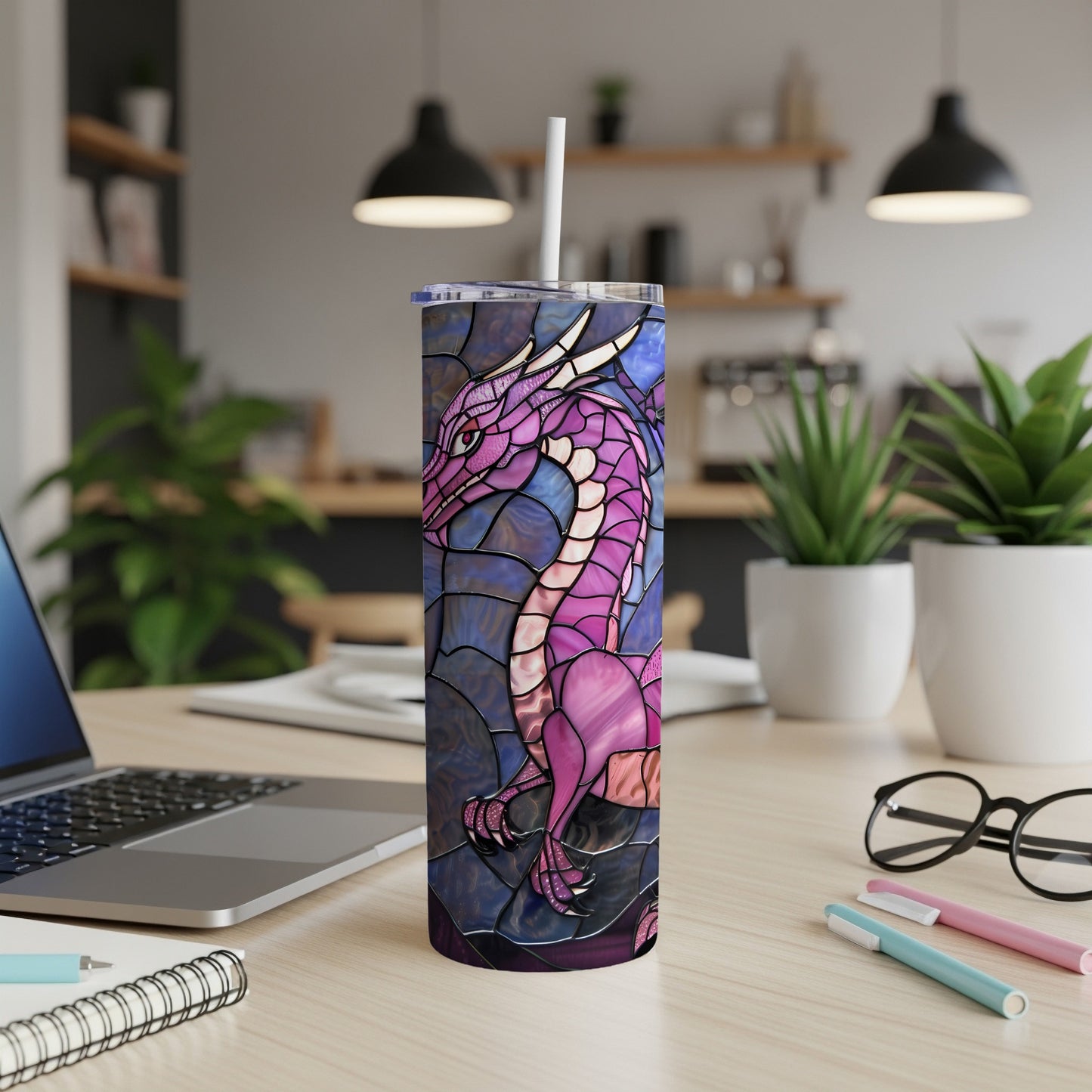 Stained glass dragon design on a white tumbler with a straw.