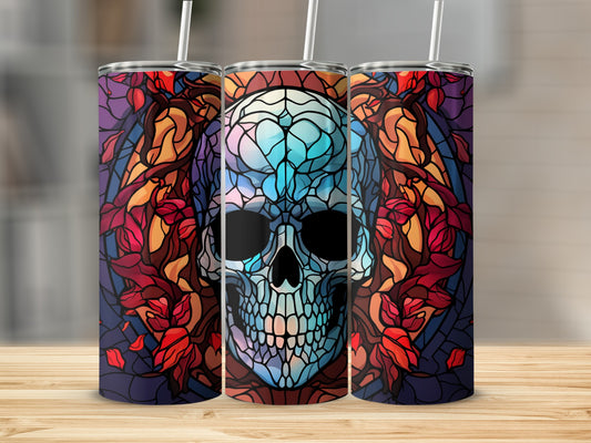 Stained glass skull tumbler with floral accents.