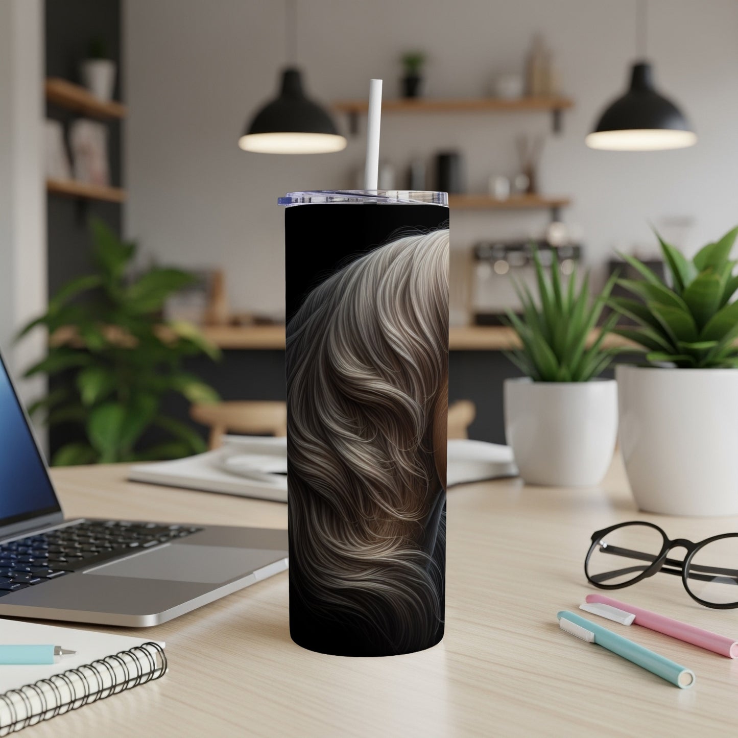 Black tumbler with woman's blonde hair design.