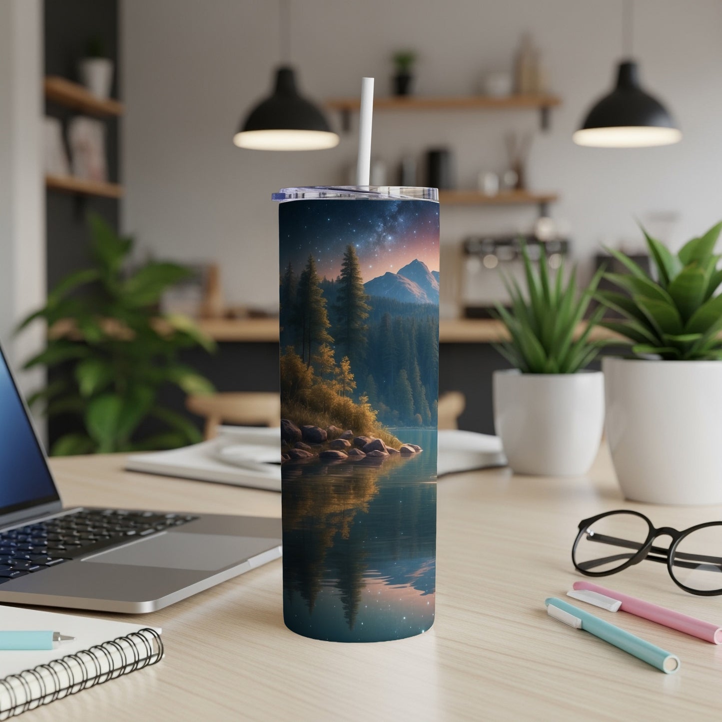 Tumbler with forest, lake, and mountain landscape under starry night sky.
