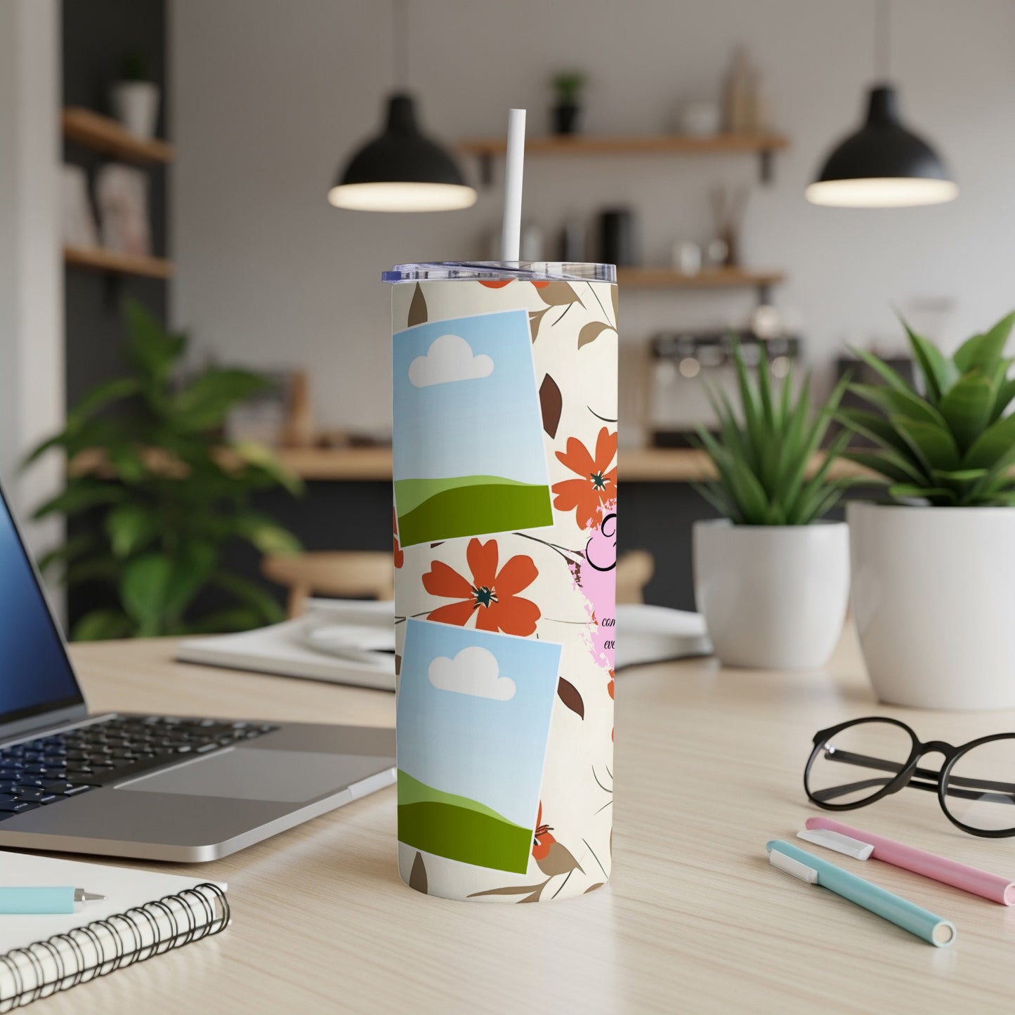 Cream tumbler with floral, bird, and photo frame design and straw.
