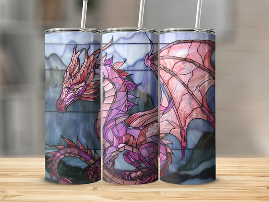 Stained glass dragon design on three tumblers with straws, against a blurred background.