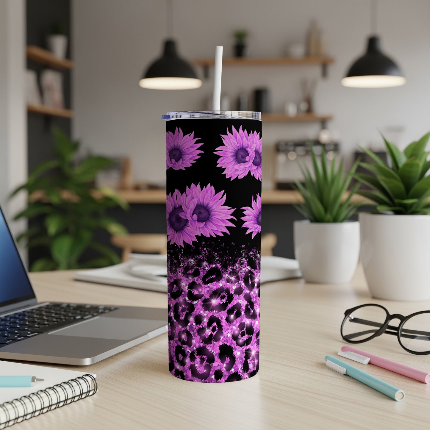 Purple leopard print tumbler with sunflowers and a straw.
