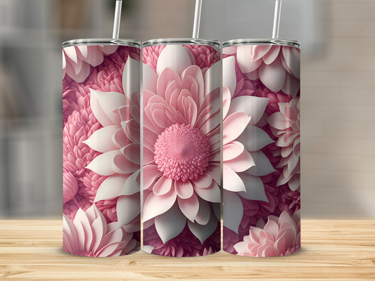 Three pink floral tumblers with straws on a wooden surface.