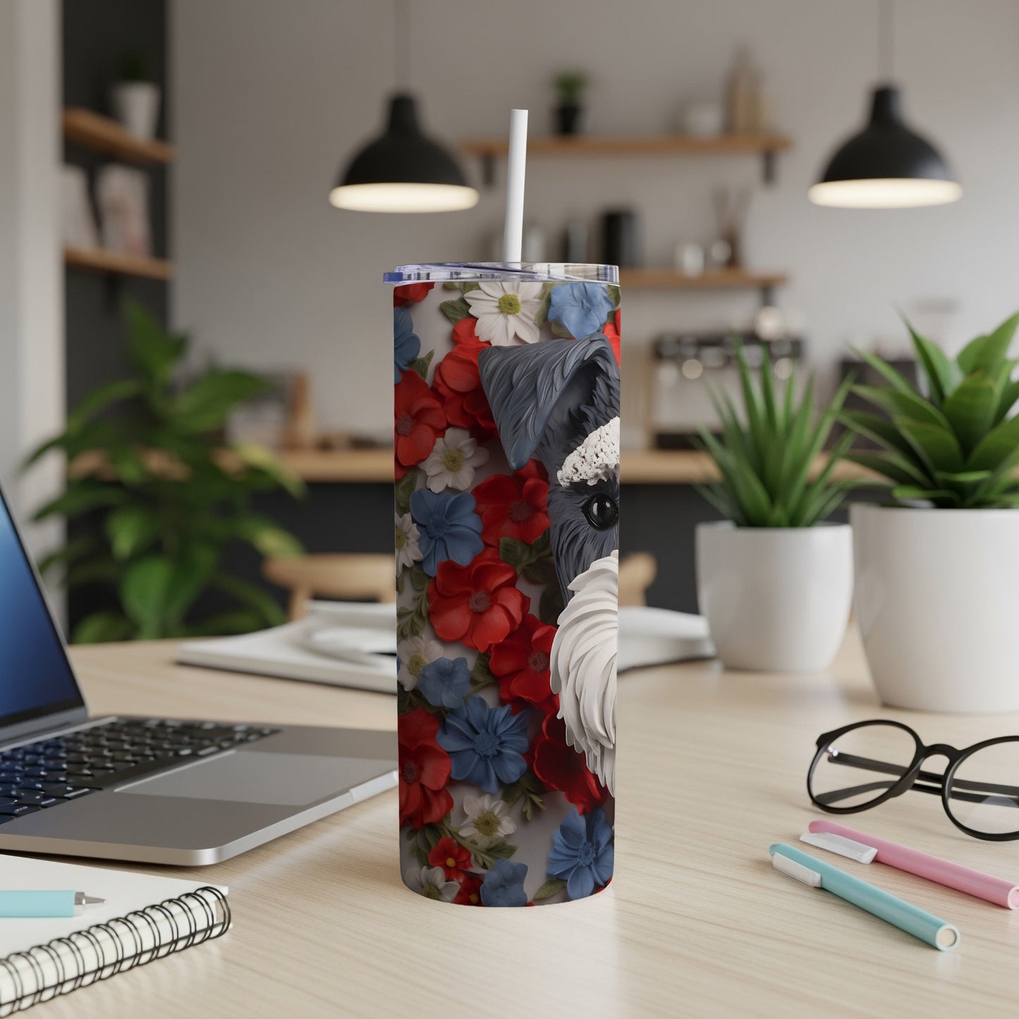 Miniature schnauzer face on a tumbler with floral and patriotic design.