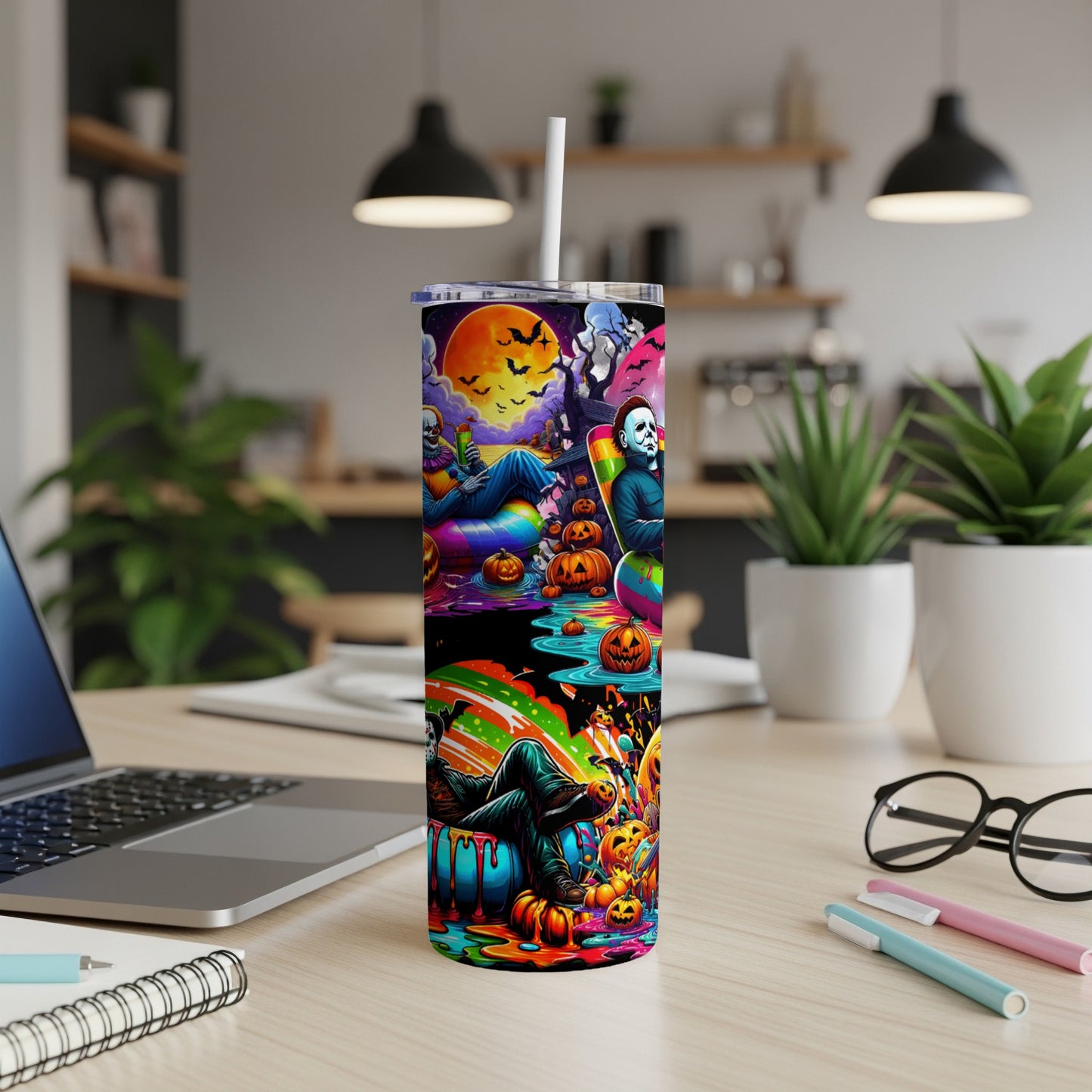 Tumbler with Halloween-themed artwork featuring Michael Myers, a clown, and pumpkins.