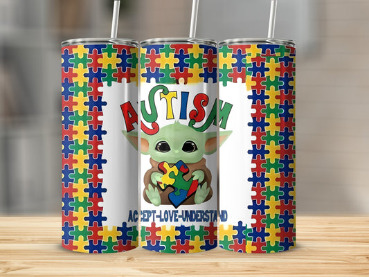 Tumbler featuring Grogu holding a puzzle piece, "Autism" text, and "Accept-Love-Understand" slogan.