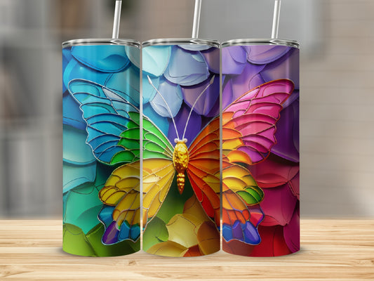 Three tumblers with stained-glass butterfly designs in rainbow colors.
