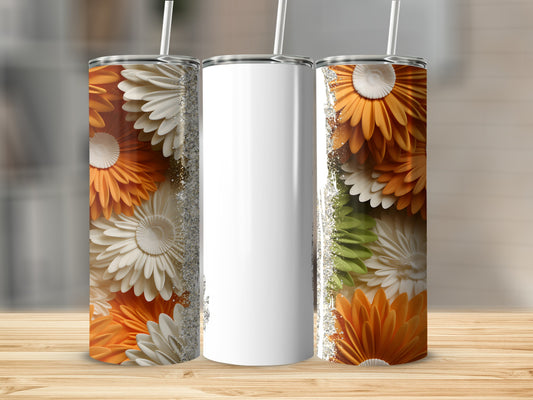 Three white tumblers with floral designs and glitter accents on a wooden surface.