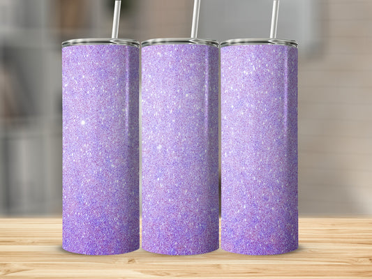 Three glittery purple tumblers with straws on a wooden surface.