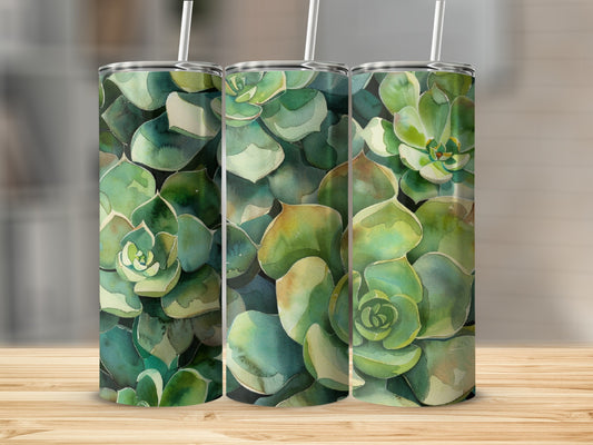 Three tumblers with a watercolor succulent pattern sit on a wooden surface.