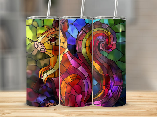 Stained glass squirrel design on three tumblers with straws.