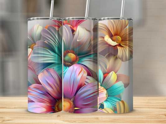 Three tumblers with colorful floral designs featuring pink, teal, and yellow petals.