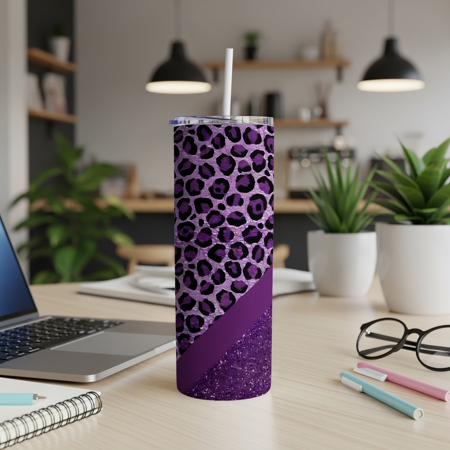 Purple leopard print tumbler with glitter accent and straw.