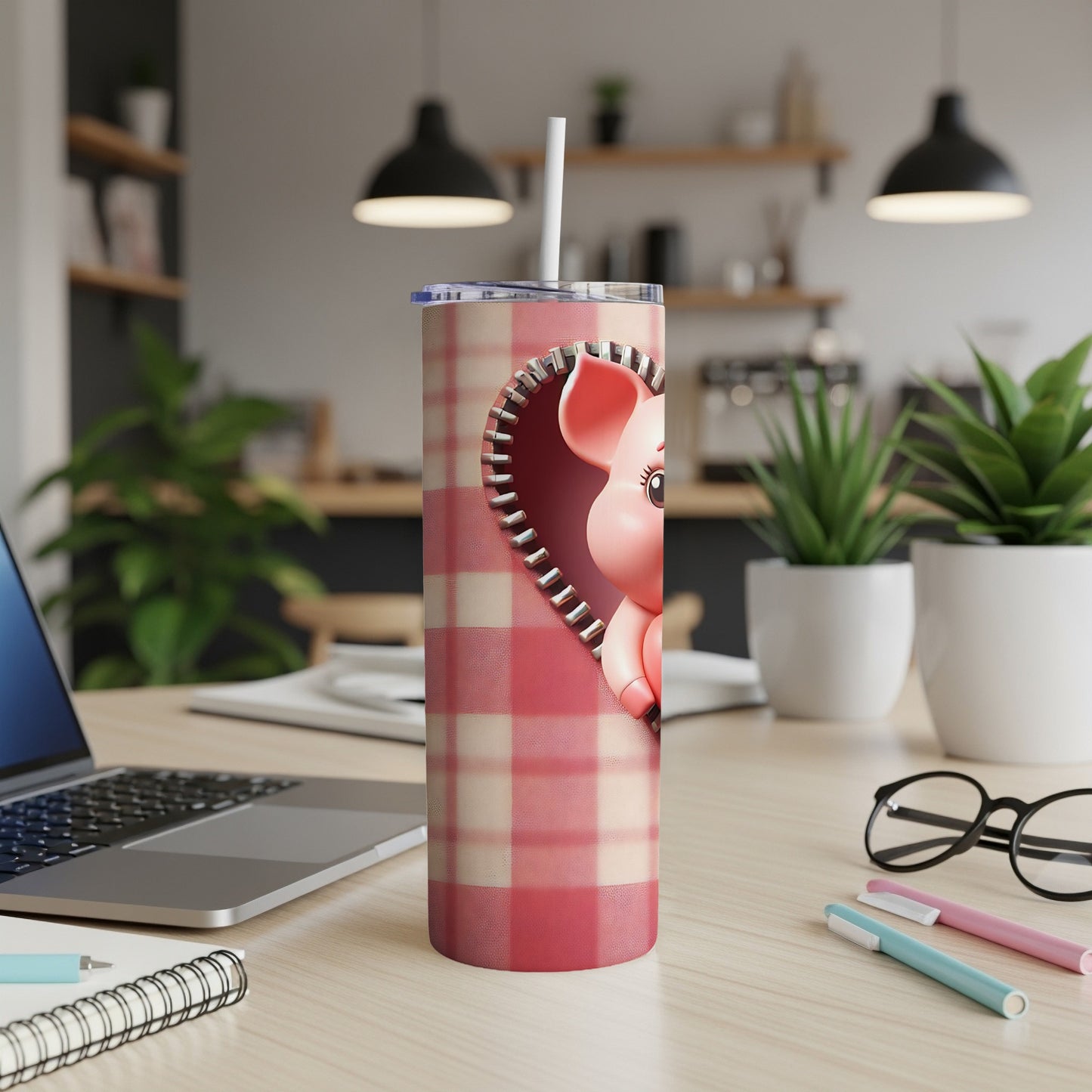 Pink pig design on a plaid tumbler with a zipper detail.