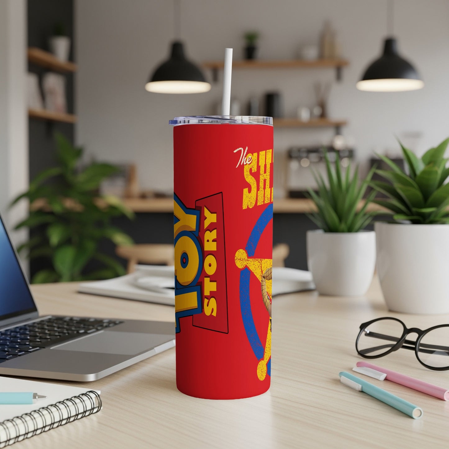 Red tumbler with Toy Story logo and Sheriff Woody illustration.