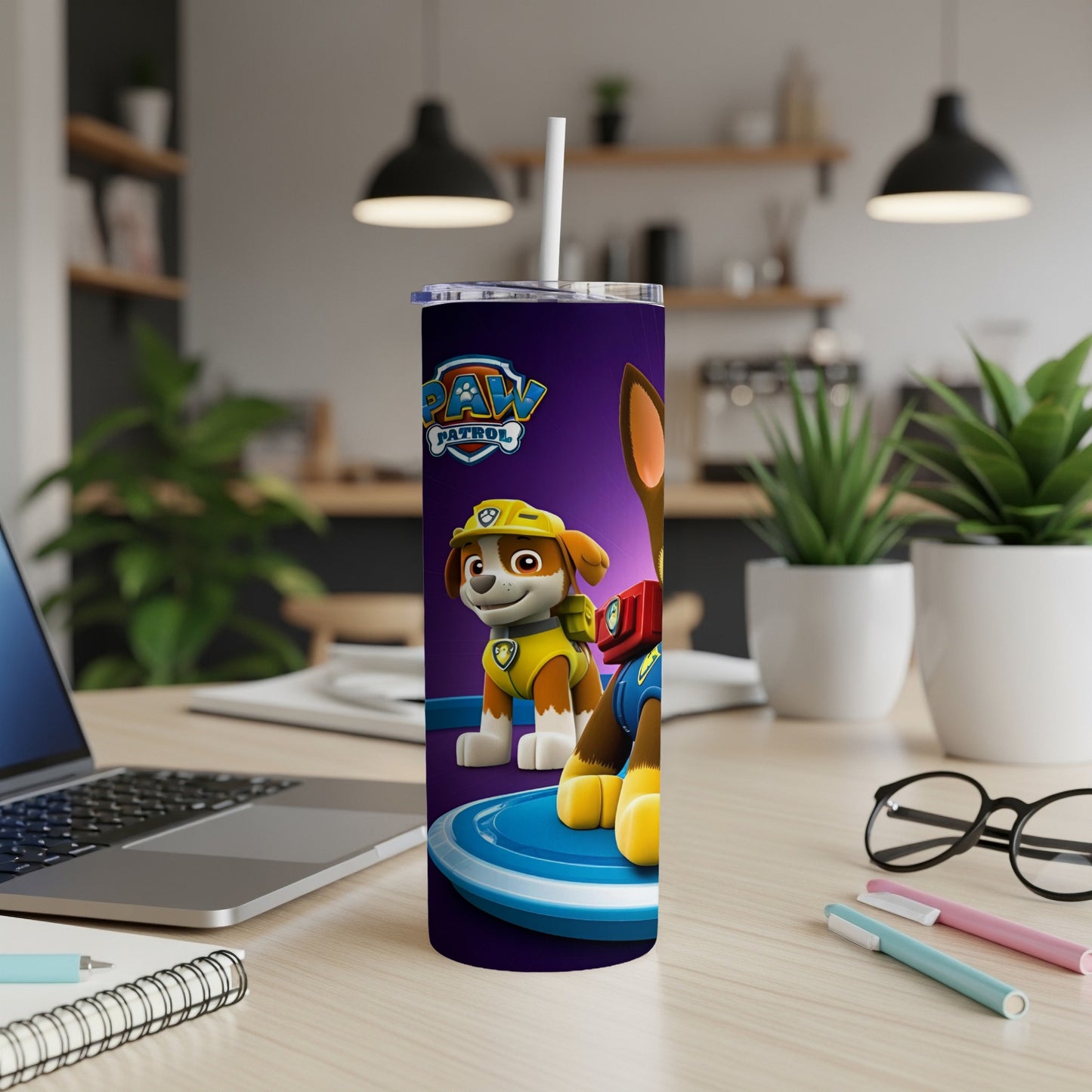 Paw Patrol Chase character on a purple tumbler with a white straw.