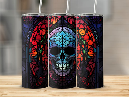 Stained glass skull tumbler with colorful floral accents.