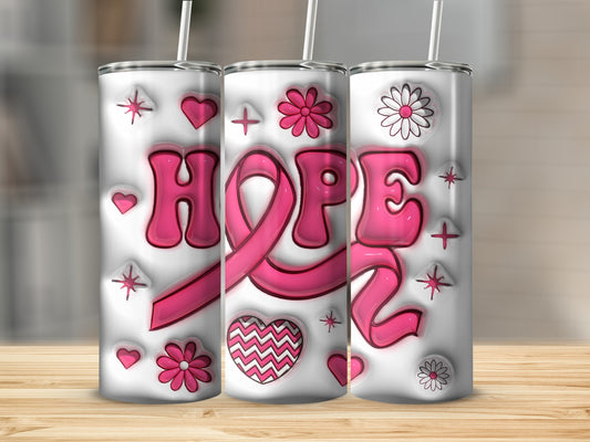 Pink ribbon with "HOPE" text, flowers, and hearts on a white tumbler.