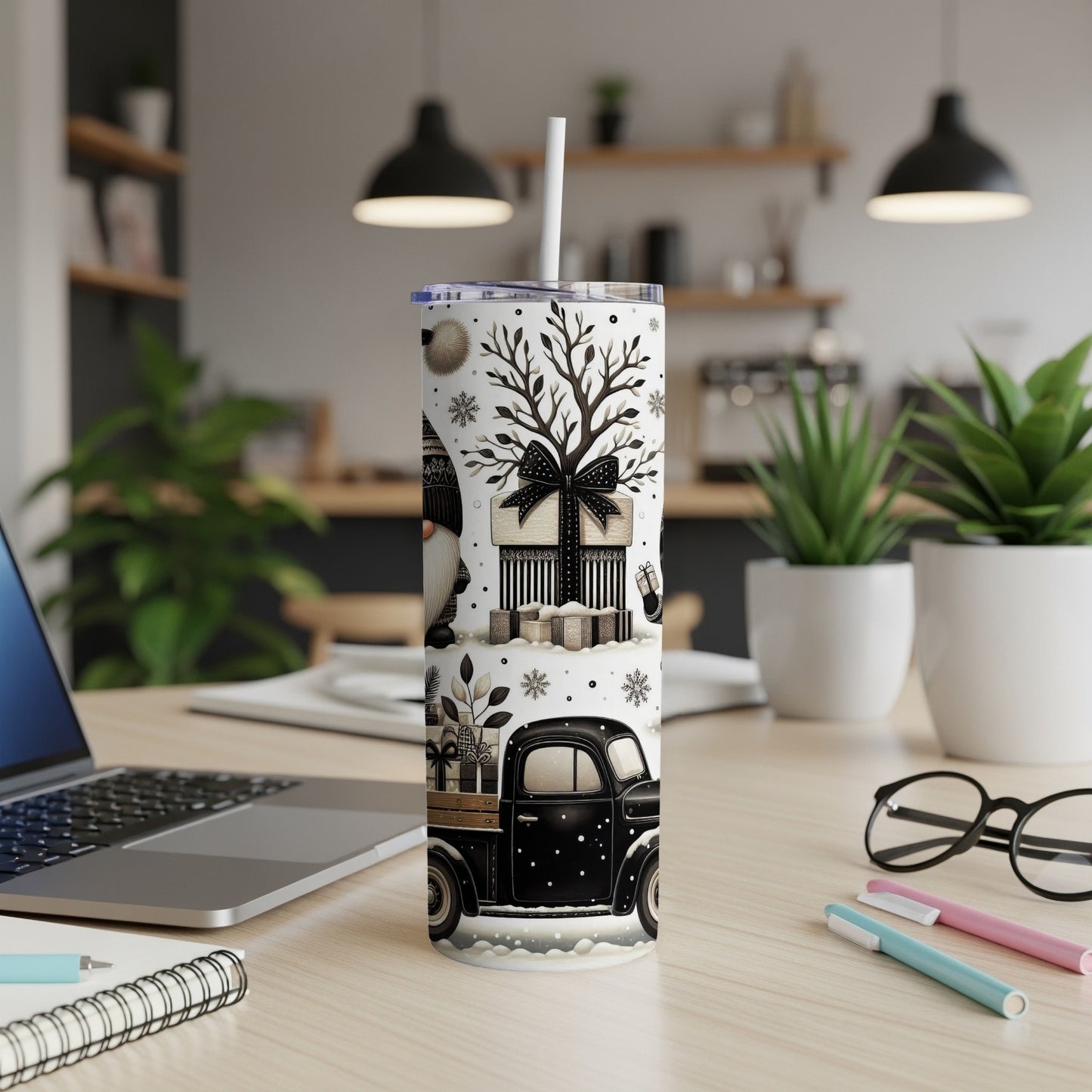 Black and white Christmas tumbler with gnomes, truck, gifts, and snowflakes.
