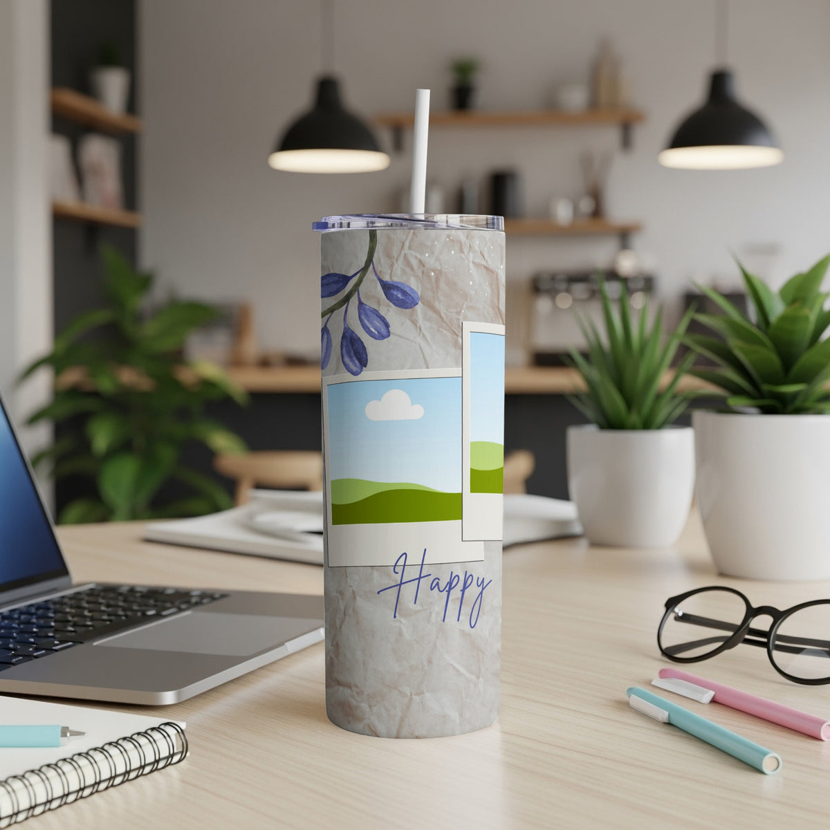 Tumbler with blue floral design, landscape photos, and the word "Happy".