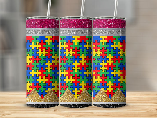Three tumblers with autism puzzle piece designs and glitter accents.