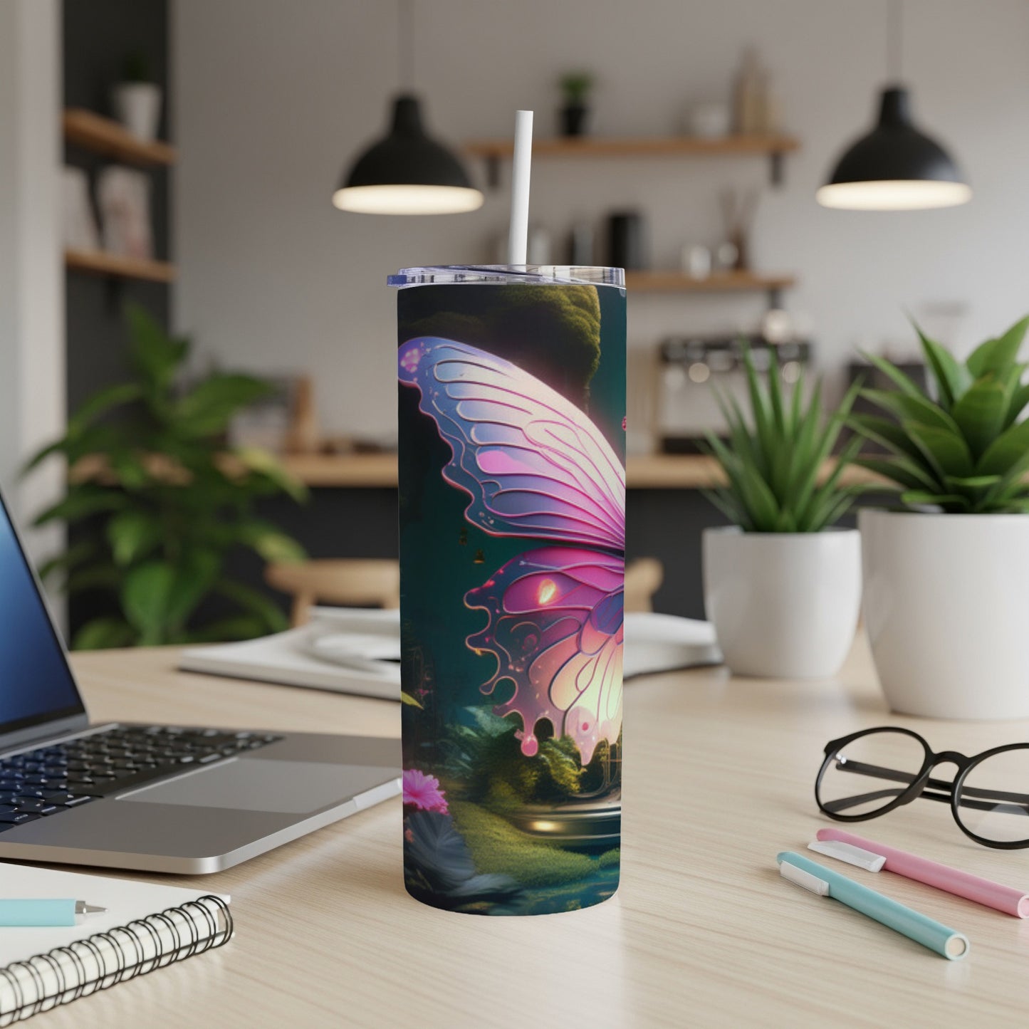 Tumbler with pink and purple butterfly wing design and straw.