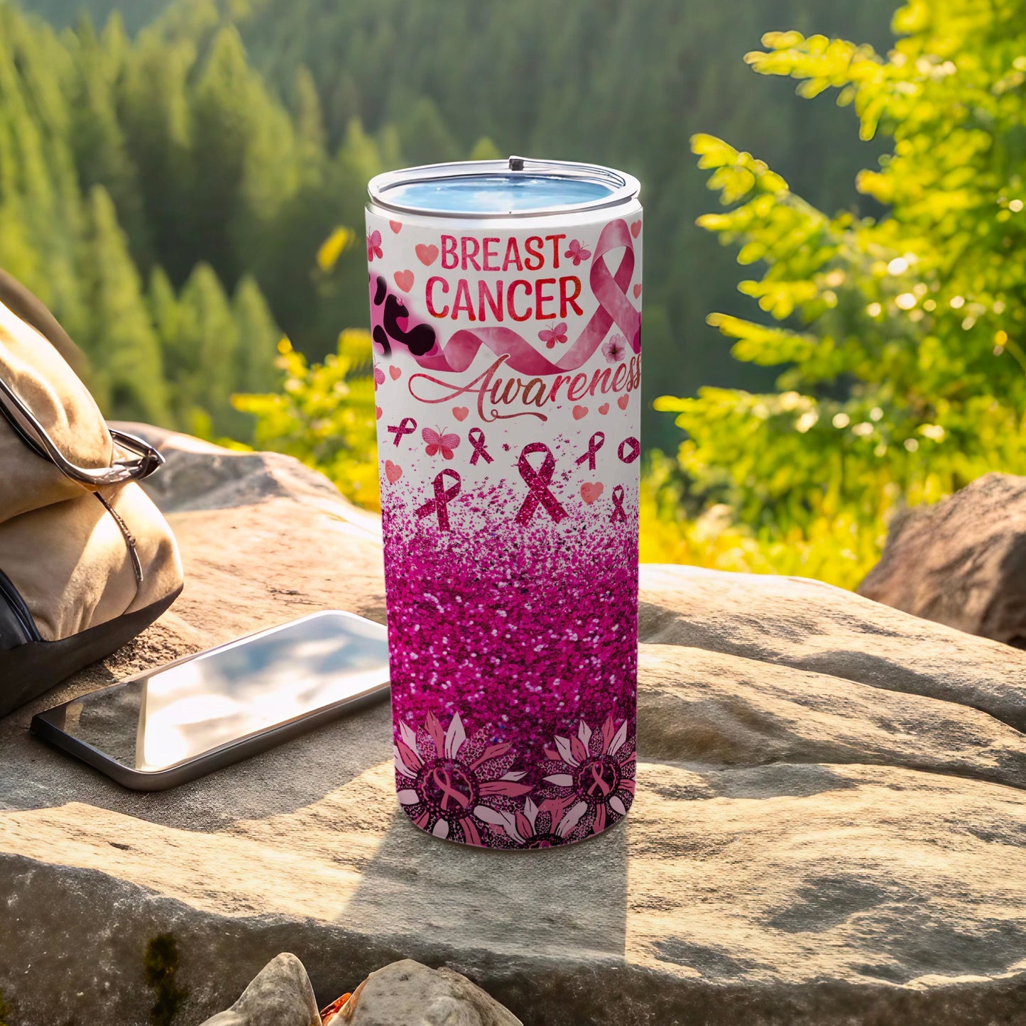 Pink glitter tumbler with breast cancer awareness ribbons and flowers.