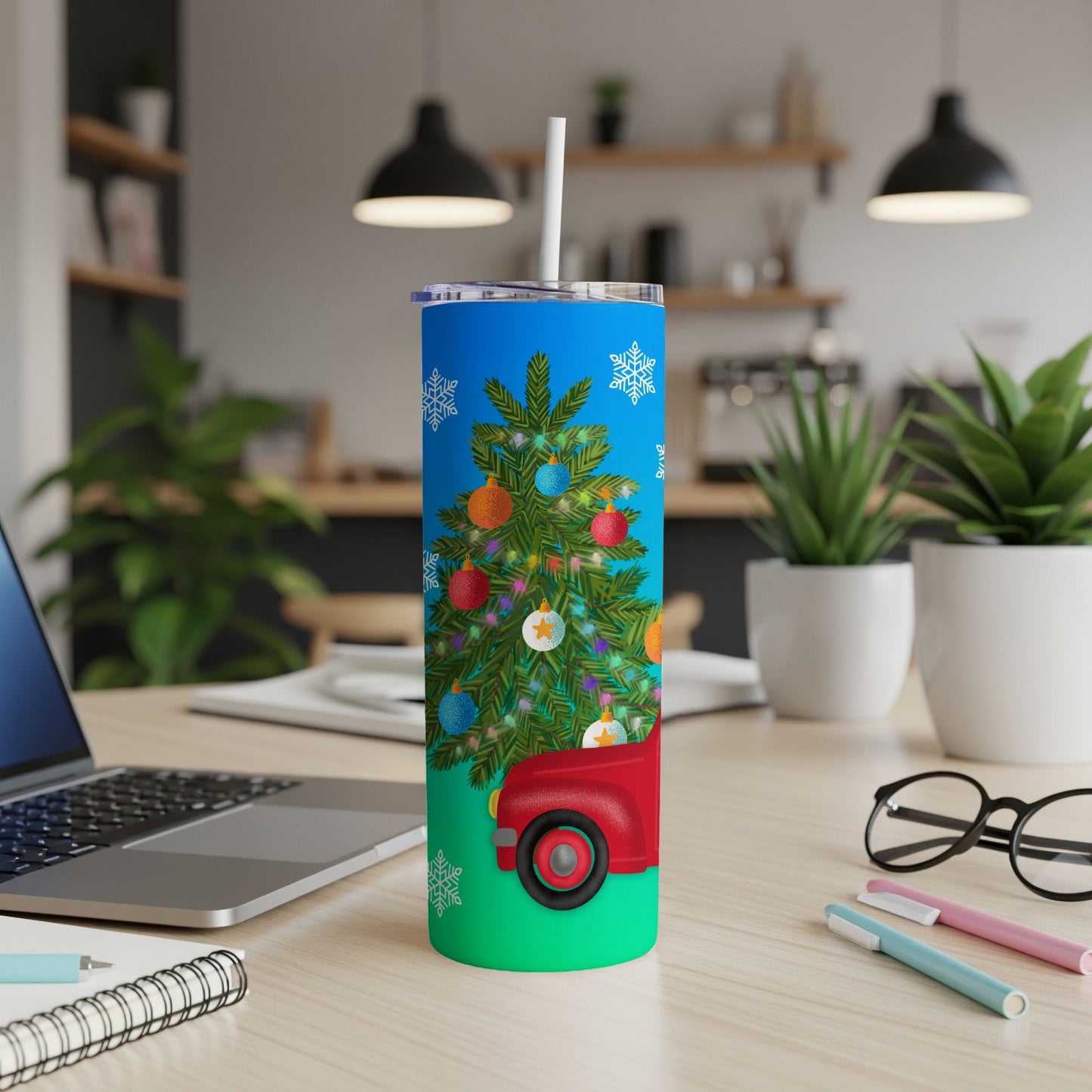 Red pickup truck carrying decorated Christmas tree on blue background tumbler.