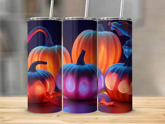 Three tumblers featuring glowing pumpkins and autumn leaves on a wooden surface.