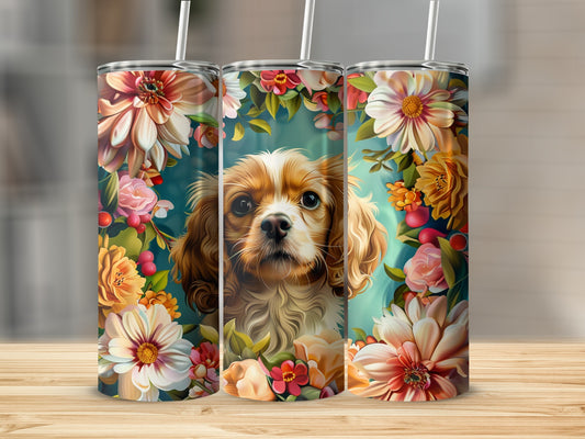 Cavalier King Charles Spaniel surrounded by colorful flowers on a skinny tumbler.