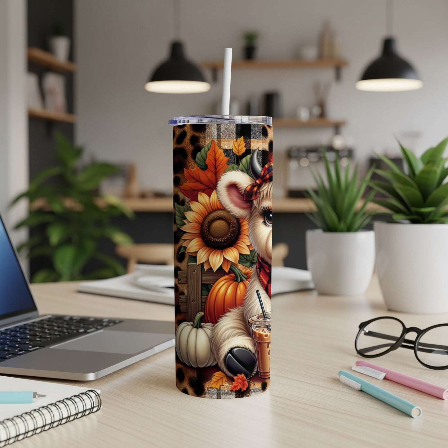 Cow with sunflowers and pumpkins on a fall-themed tumbler.