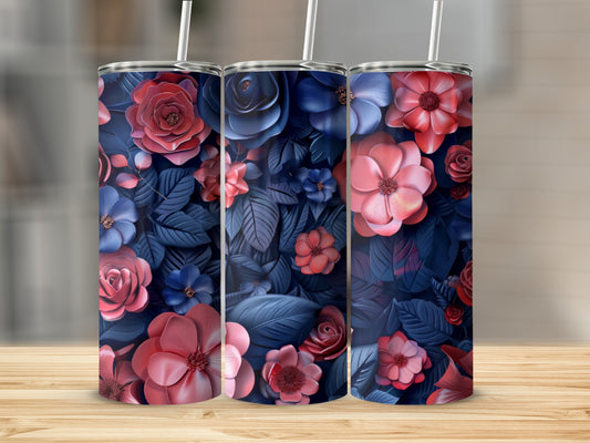 Three floral-patterned tumblers with pink and blue flowers and dark blue leaves.