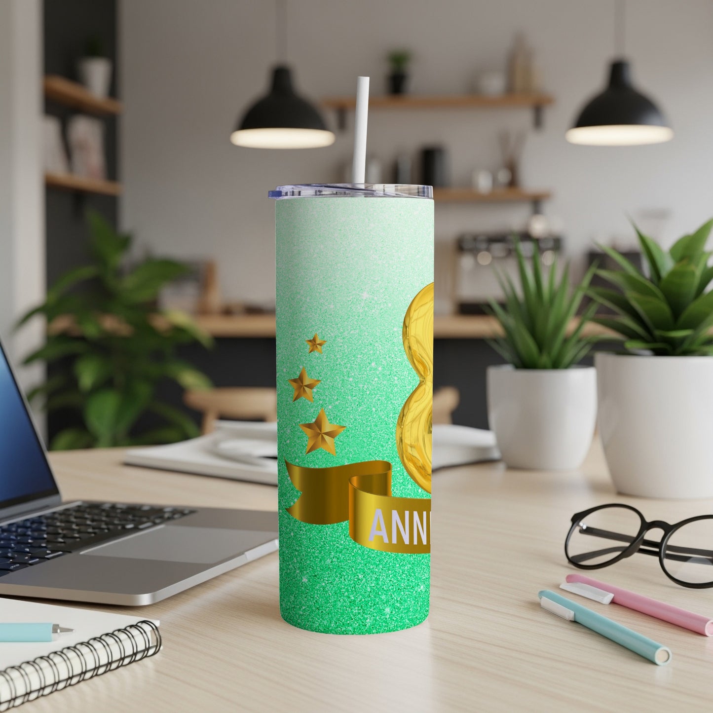 Green glitter tumbler with gold stars and "Anniversary" ribbon.
