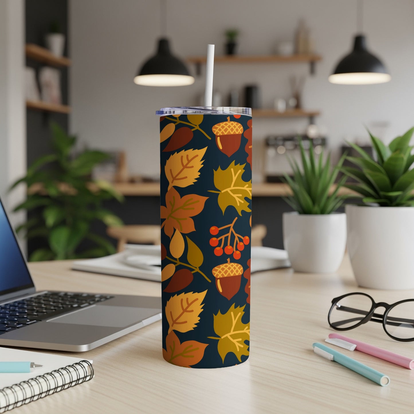 Dark navy tumbler with autumn leaves, acorns, and berries pattern.