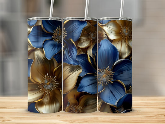 Three tumblers with blue and gold floral designs stand on a wooden surface.