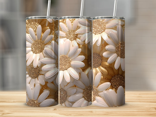 Three white and gold glitter daisy tumblers on a wooden surface.