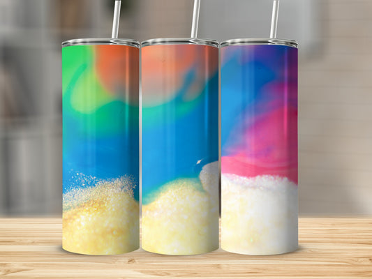 Three tumblers with colorful abstract designs on a wooden surface.