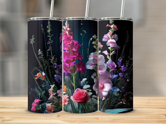 Three tumblers with a vibrant floral design against a dark background.