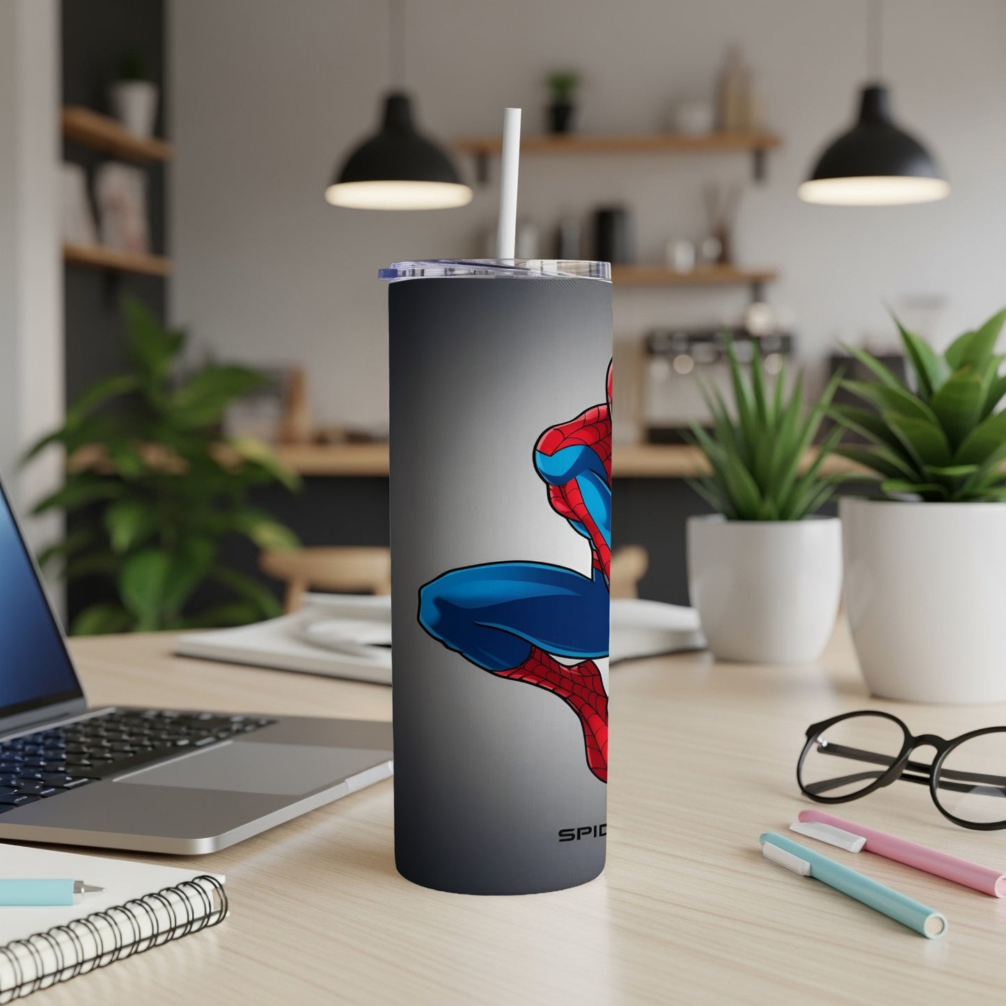 Spider-Man character art on a gray tumbler with a white straw.