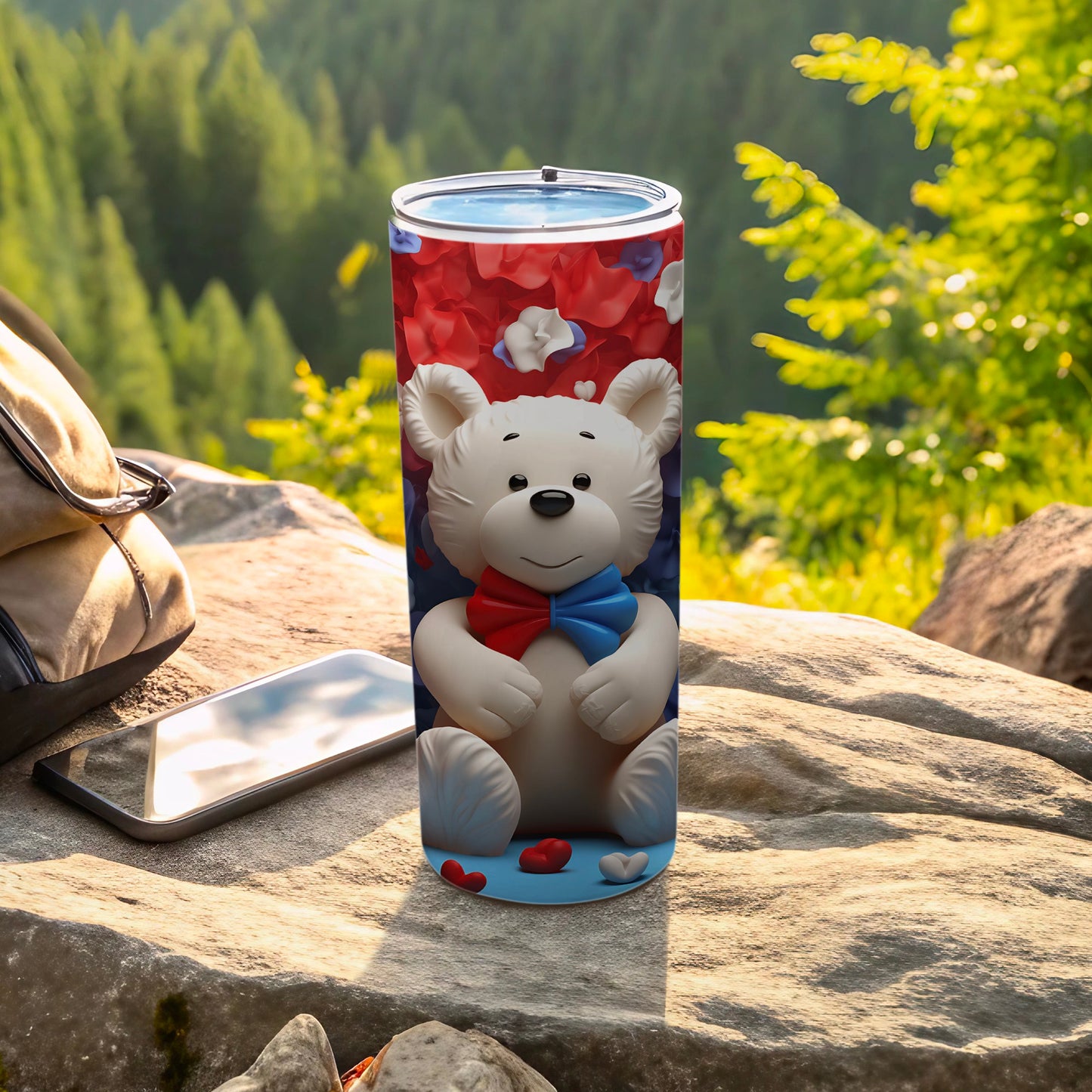 White teddy bear in patriotic red, white, and blue on a blue tumbler.
