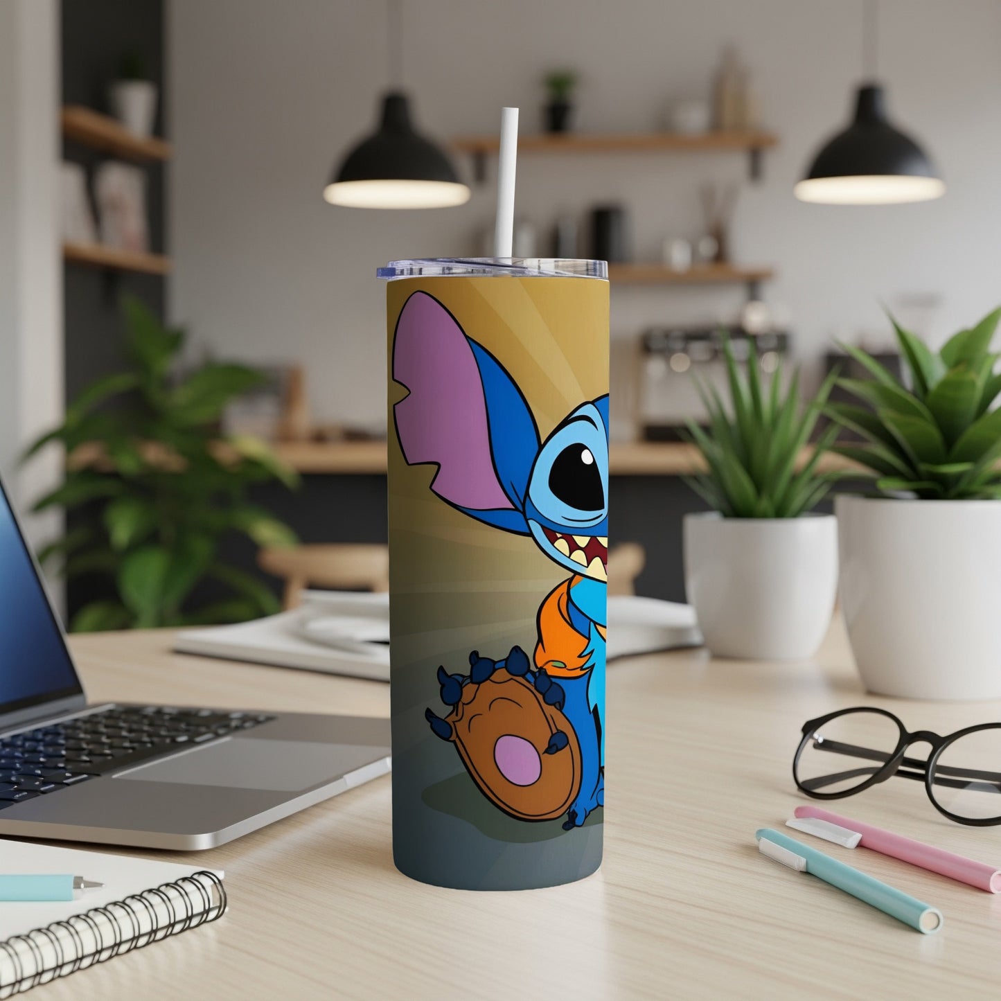 Stitch character on a gold and orange gradient tumbler with a straw.