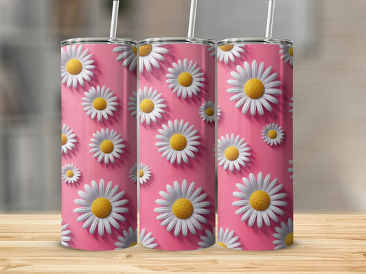 Three pink tumblers with white daisy pattern and straws.