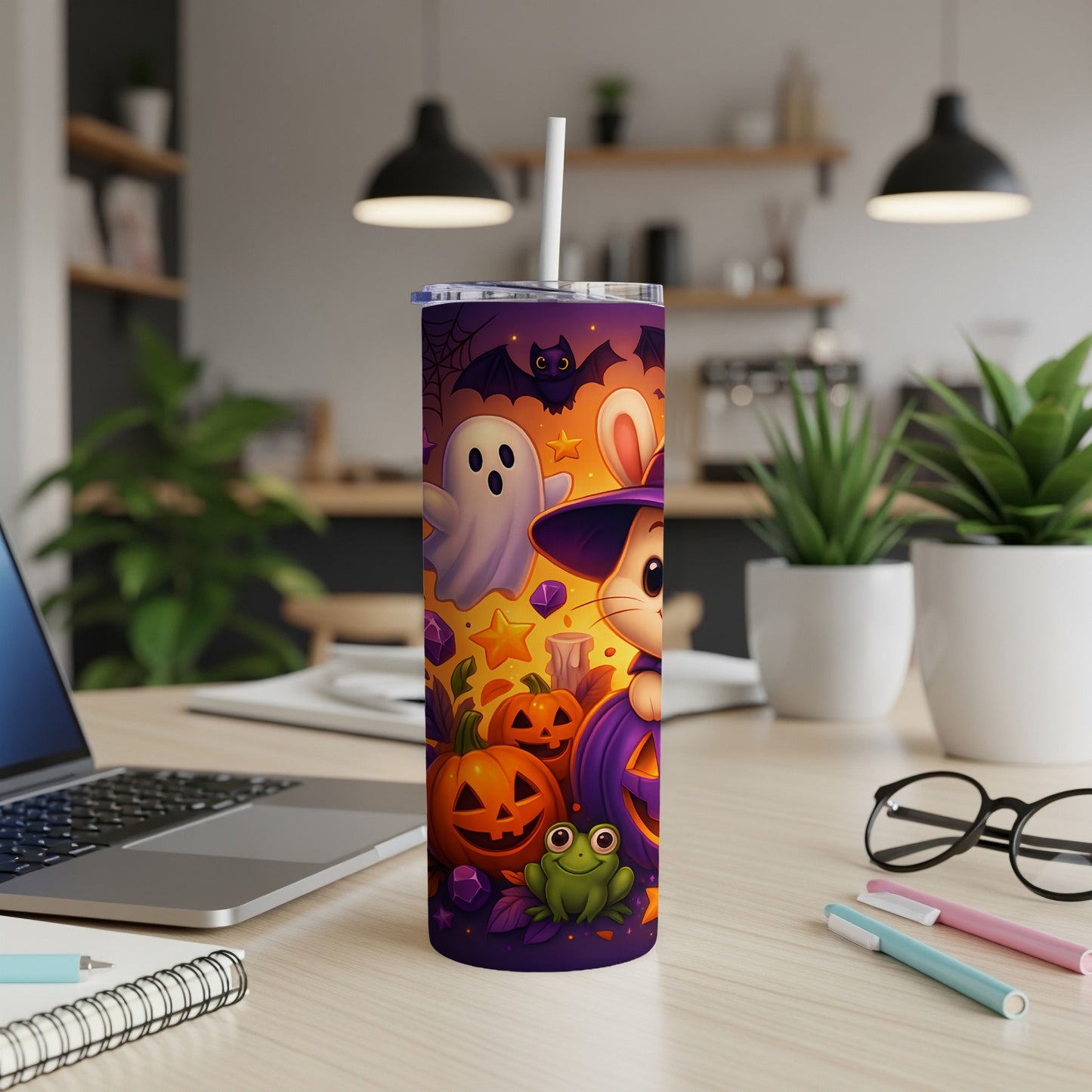 Halloween tumbler with cartoon ghost, bats, rabbit, and pumpkins.