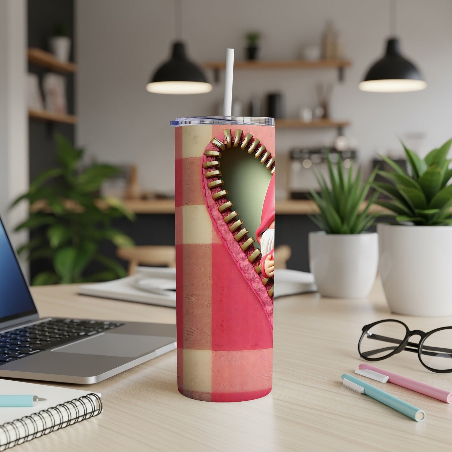 Pink plaid tumbler with a zipper revealing a heart and cartoon character.