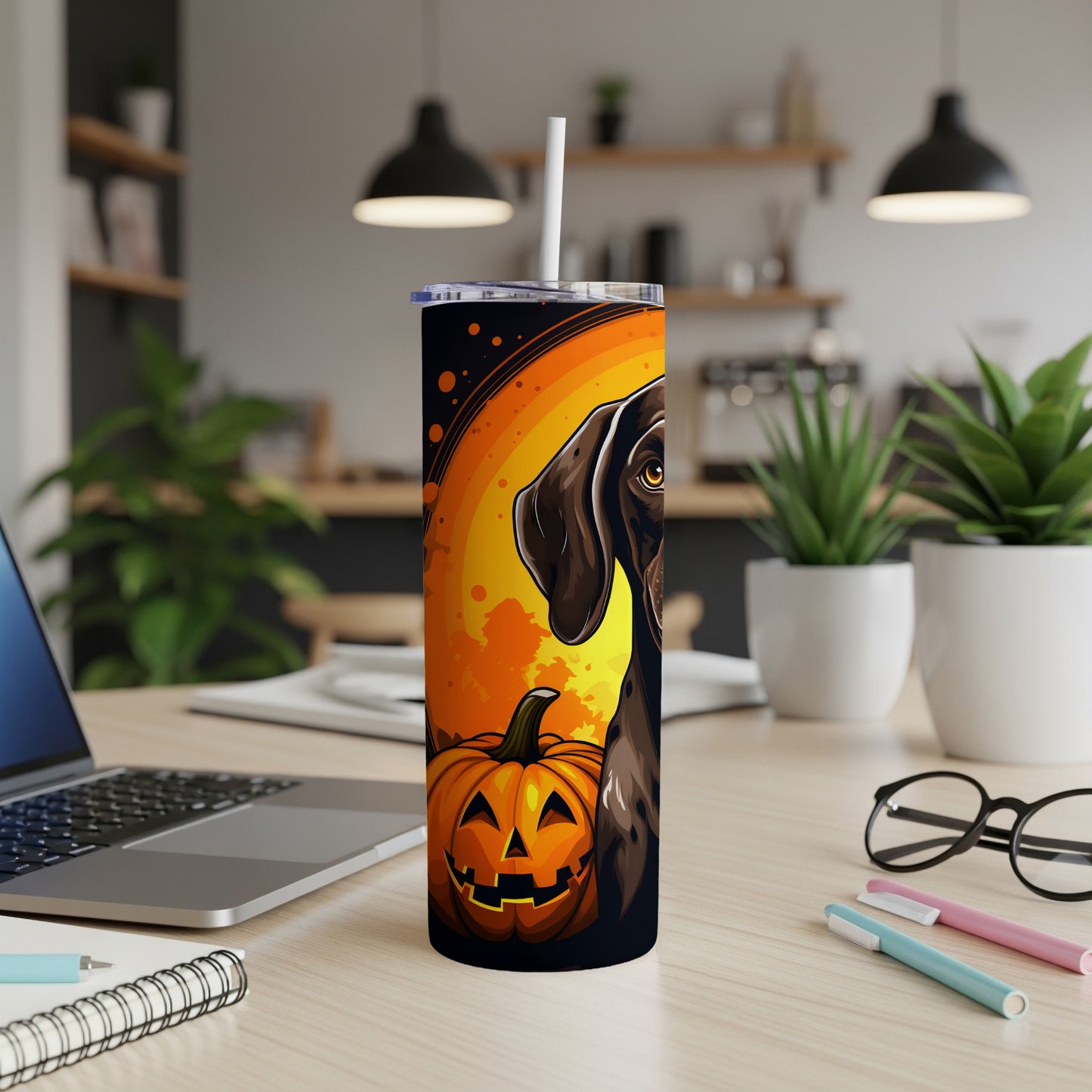 Tumbler with dark brown dog and jack-o'-lantern Halloween design on orange background.