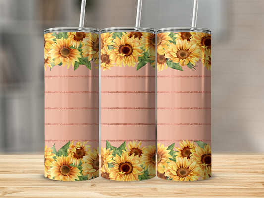 Three tumblers with sunflowers and rose gold stripes against a blurred background.