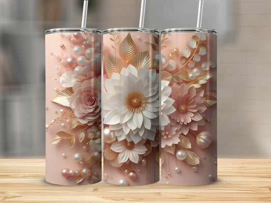Three pink tumblers with floral and pearl designs, on a wooden surface.